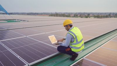 Technician Mounting Solar Panels